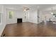 Spacious living room with natural light, complemented by a fireplace and wood-look flooring at 306 Cecil St, Durham, NC 27707