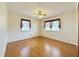 Cozy bedroom with natural light, original hardwood floors, and neutral paint at 310 Meadowbrook Dr, Burlington, NC 27215