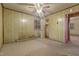 This bedroom features wood paneling, two windows, ceiling fan and closet at 3416 North Ridge Dr, Sanford, NC 27330