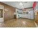 The kitchen featuring wood paneling, white cabinets and appliances at 3416 North Ridge Dr, Sanford, NC 27330