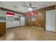 An outdated kitchen with white cabinets and appliances, and wood paneling walls at 3416 North Ridge Dr, Sanford, NC 27330