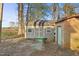 The sheds feature wood paneling, doors, windows, and a green foundation at 3416 North Ridge Dr, Sanford, NC 27330