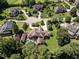Aerial view showcasing an upscale neighborhood with beautifully landscaped lawns and luxurious homes at 3505 Jonaway Cir, Fuquay Varina, NC 27526