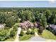 An aerial view of an estate featuring lush landscaping, mature trees, and a grand entrance at 3505 Jonaway Cir, Fuquay Varina, NC 27526