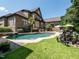 Backyard showcasing a luxurious pool, patio area, and well-manicured lawn at 3505 Jonaway Cir, Fuquay Varina, NC 27526