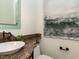 Chic powder room with a vessel sink, granite countertop, decorative mirror, and modern fixtures at 3505 Jonaway Cir, Fuquay Varina, NC 27526