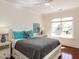 Bright bedroom features hardwood floors, large window, and stylish decor at 3505 Jonaway Cir, Fuquay Varina, NC 27526