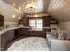 Cozy bonus room with custom built-ins, window seat, and plush seating area at 3505 Jonaway Cir, Fuquay Varina, NC 27526
