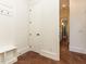 Bright hallway with tiled floors, white trim, built-in storage, and an open doorway leading to another room at 3505 Jonaway Cir, Fuquay Varina, NC 27526