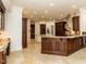 Spacious open kitchen featuring custom cabinetry, granite countertops, and a chef's island for seamless entertaining at 3505 Jonaway Cir, Fuquay Varina, NC 27526