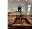 Close-up of copper kitchen sink and granite countertop, highlighting the kitchen's luxury and functionality at 3505 Jonaway Cir, Fuquay Varina, NC 27526