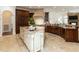 Gourmet kitchen featuring custom cabinetry, granite countertops, and an island, perfect for culinary enthusiasts at 3505 Jonaway Cir, Fuquay Varina, NC 27526