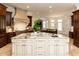 Gourmet kitchen with a large island, granite countertops, and custom cabinetry, perfect for culinary creations at 3505 Jonaway Cir, Fuquay Varina, NC 27526