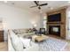 Inviting living room with a stone fireplace, recessed lighting, and comfortable neutral furnishings at 3505 Jonaway Cir, Fuquay Varina, NC 27526