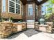 A fully equipped outdoor kitchen with stainless steel appliances and stone accents, perfect for entertaining at 3505 Jonaway Cir, Fuquay Varina, NC 27526
