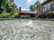 Backyard pool featuring a fountain, stone patio, and outdoor living area at 3505 Jonaway Cir, Fuquay Varina, NC 27526