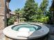 An inviting backyard oasis featuring a sparkling pool, jacuzzi, and lush landscaping for ultimate relaxation at 3505 Jonaway Cir, Fuquay Varina, NC 27526
