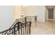 Ornate staircase featuring iron railing and chandelier, creating an elegant entry at 3505 Jonaway Cir, Fuquay Varina, NC 27526