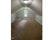 Spacious attic area featuring built-ins and a window for natural light at 3537 Layton Ridge Dr, Apex, NC 27539