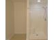 Bathroom featuring walk in shower with white tile, bright lighting and neutral tones at 3537 Layton Ridge Dr, Apex, NC 27539