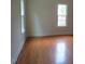Bedroom with hardwood floors and windows providing lots of light at 3537 Layton Ridge Dr, Apex, NC 27539