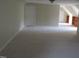 Spacious carpeted bedroom featuring built in shelves and neutral colors at 3537 Layton Ridge Dr, Apex, NC 27539