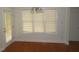 Dining room featuring hardwood floors, multiple windows and a chandelier at 3537 Layton Ridge Dr, Apex, NC 27539