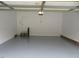 View of the interior of an empty two car garage with painted floor at 3537 Layton Ridge Dr, Apex, NC 27539