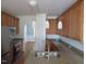 Well-lit kitchen with granite countertops, stainless steel sink, and pendant lighting at 3537 Layton Ridge Dr, Apex, NC 27539