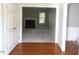 Open doorway to a spacious living room with a fireplace and abundant natural light at 3537 Layton Ridge Dr, Apex, NC 27539