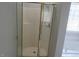 Bright bathroom featuring a standalone shower with sliding glass doors and gold-tone accents at 3537 Layton Ridge Dr, Apex, NC 27539