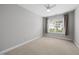 Light and airy bedroom with a ceiling fan, window and neutral carpet at 408 Indian Elm Ln, Cary, NC 27519