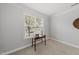 Neutral bedroom with carpet, table and view from the window at 408 Indian Elm Ln, Cary, NC 27519