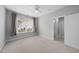 Comfortable bedroom featuring neutral tones, ceiling fan, and great natural light at 408 Indian Elm Ln, Cary, NC 27519