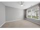 Light and airy bedroom with a ceiling fan, window and neutral carpet at 408 Indian Elm Ln, Cary, NC 27519
