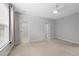Spacious bedroom featuring neutral tones, ceiling fan, and large closets at 408 Indian Elm Ln, Cary, NC 27519
