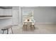 Bright dining area with a large window for natural light and table with four chairs at 408 Indian Elm Ln, Cary, NC 27519