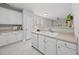 Bright kitchen with white cabinets and appliances, offering plenty of storage at 408 Indian Elm Ln, Cary, NC 27519