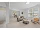 Bright living room with neutral walls, carpet, and natural light from large windows at 408 Indian Elm Ln, Cary, NC 27519