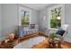 Cozy Bedroom features a crib, rocking chair, and two windows for lots of natural light at 410 N Hyde Park Ave, Durham, NC 27703