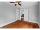Spacious bedroom with hardwood floors, light blue walls, and neutral trim at 410 N Hyde Park Ave, Durham, NC 27703