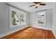 Bedroom featuring hardwood floors, light blue walls, and natural light from the window at 410 N Hyde Park Ave, Durham, NC 27703