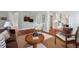 Comfortable living room showcasing hardwood floors and an open layout into kitchen at 410 N Hyde Park Ave, Durham, NC 27703
