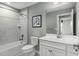 Well lit bathroom with a shower and tub combination and a vanity with good storage at 425 Grand Silo Rd, Garner, NC 27603