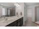 Bathroom with dual vanities, modern fixtures, and a walk-in shower at 433 Mockingbird Ln, Mebane, NC 27302