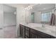 En-suite bathroom with double vanity, modern fixtures, and tiled flooring at 433 Mockingbird Ln, Mebane, NC 27302