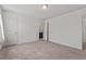 A carpeted bedroom has a door on the left that leads to the bathroom and another door on the left at 433 Mockingbird Ln, Mebane, NC 27302