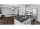 Modern kitchen featuring stainless steel appliances, granite countertops, and a double sink at 433 Mockingbird Ln, Mebane, NC 27302