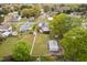 Residential home featuring a backyard with a deck, storage shed, and a white picket fence at 440 S Church St, Coats, NC 27521