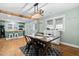 Dining room showcases modern lighting and an open floorplan with a kitchen view at 440 S Church St, Coats, NC 27521